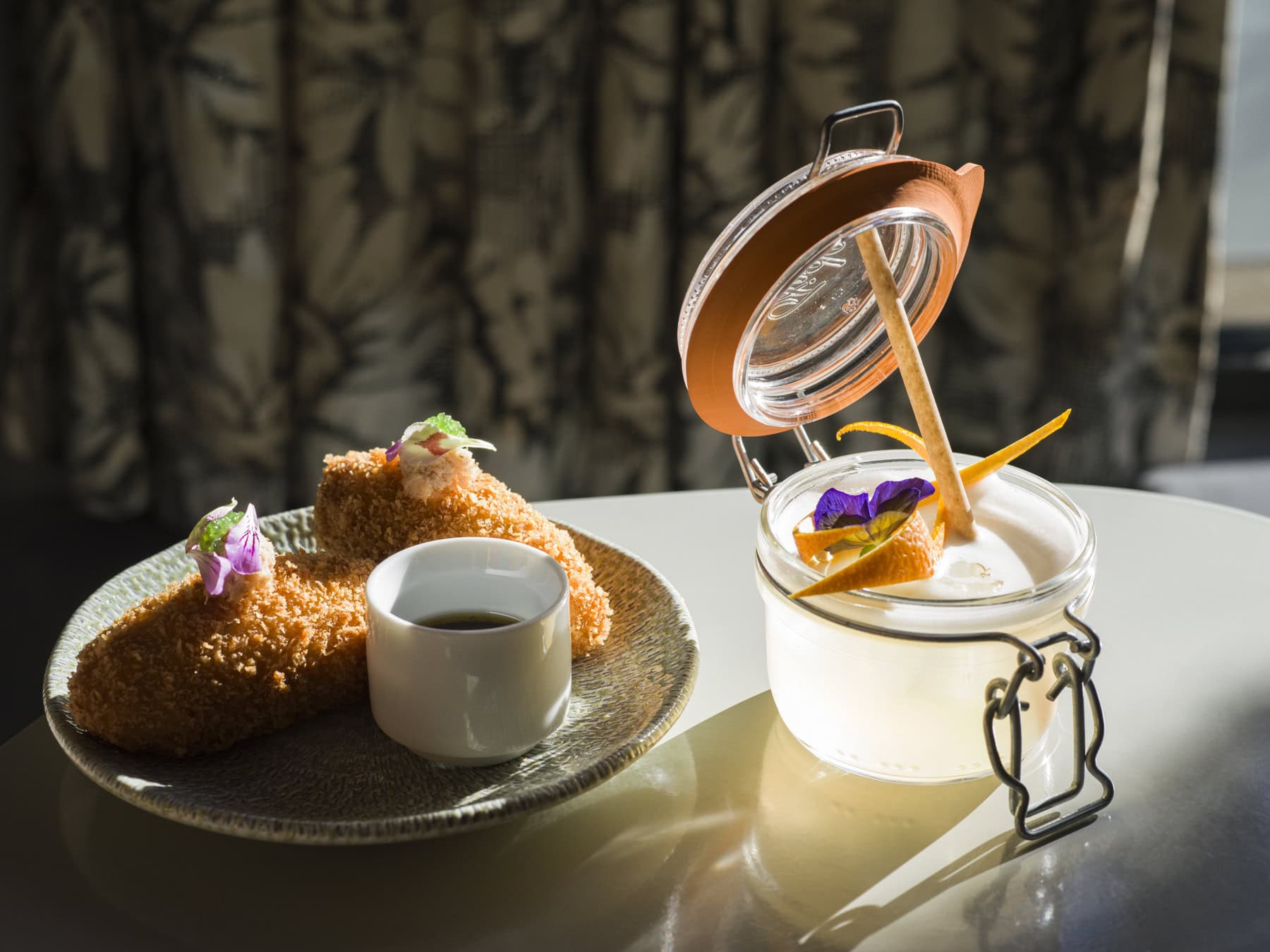 Artfully plated gourmet dish with elegant dessert