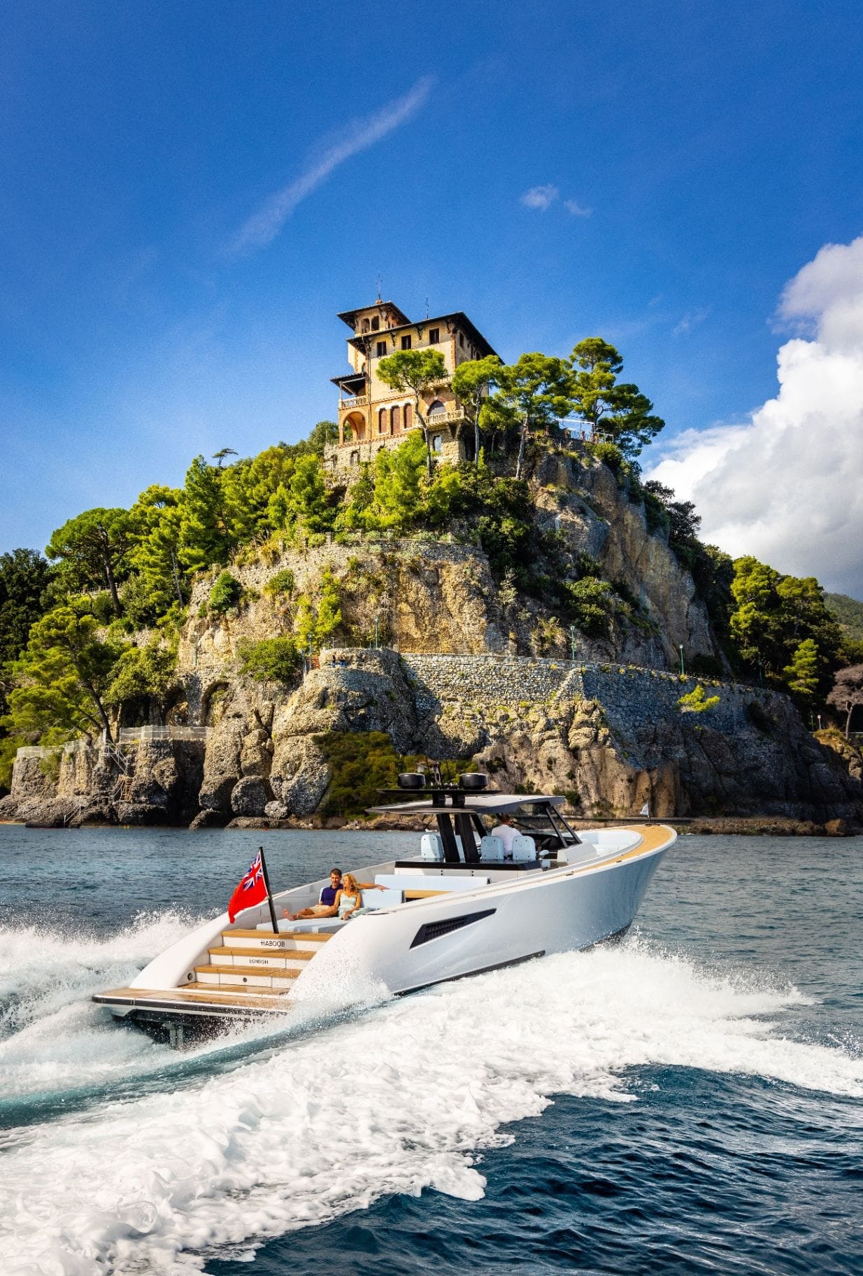 Luxury yacht cruising along the French Riviera coastline comparing day and multi-day charters